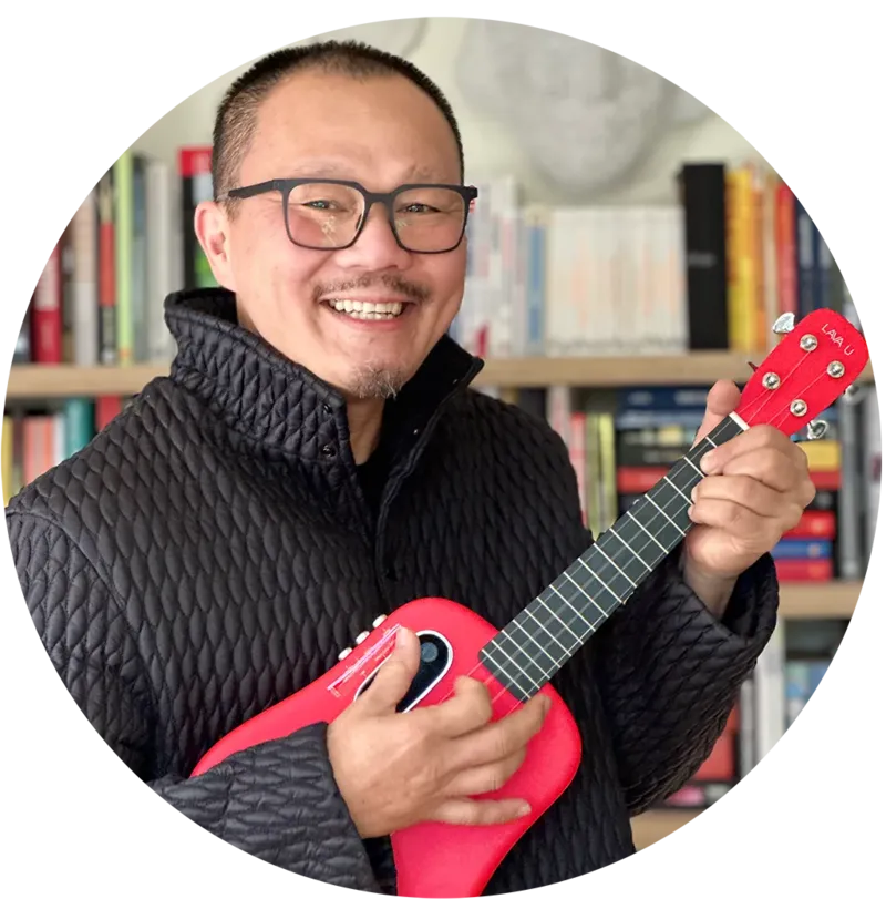 Frven Lim facilitating a HappierMusic ukulele wellbeing session for elderly residents — The Ministry of Happier, North London